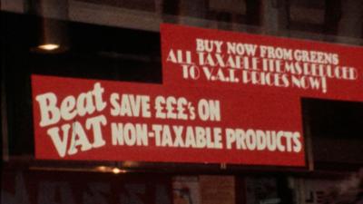Sale sign in shop window advertising VAT free goods.