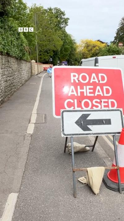 A 'road ahead closed' sign, on a road