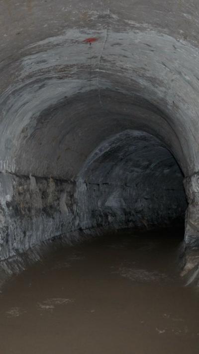 An archway in a dark underground cave