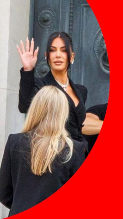 Kim Kardashian waves from the court steps in Paris
