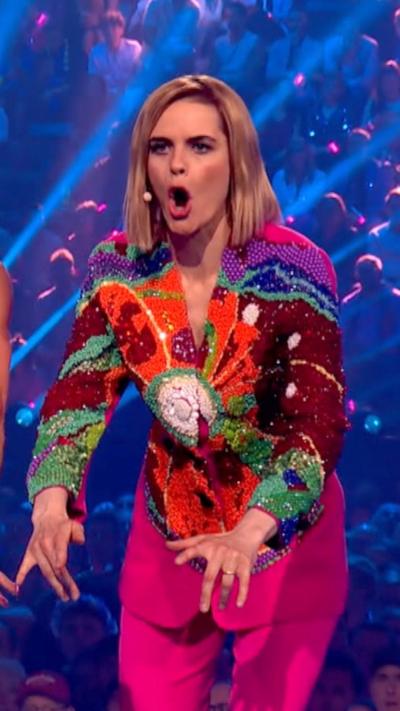 Lady with multicoloured shirt presenting Euorvision
