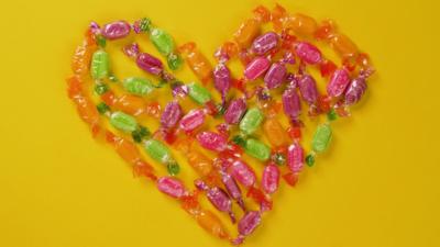 A heart shape made out of colourful sweets