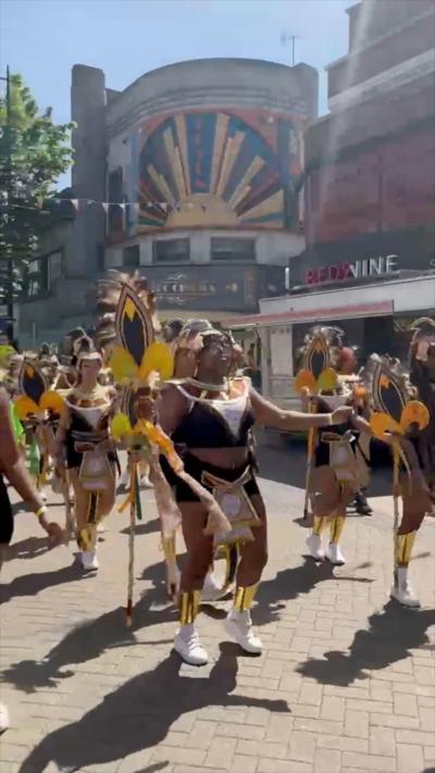 Dancers in costumes for Luton Carnival parade