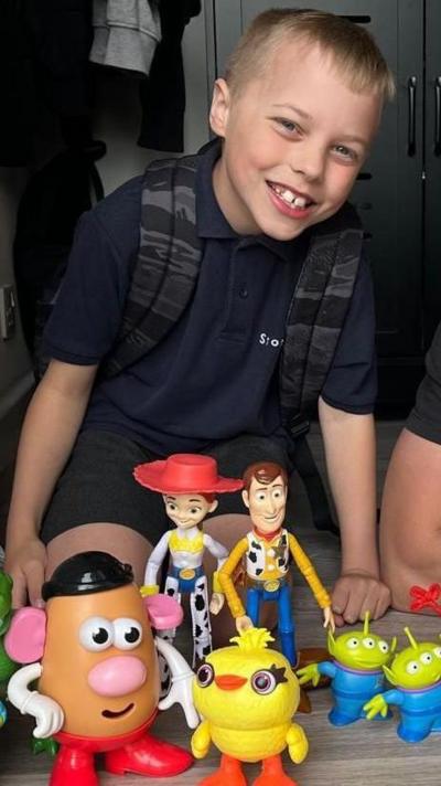 10-year-old Vinny with his Toy Story figures