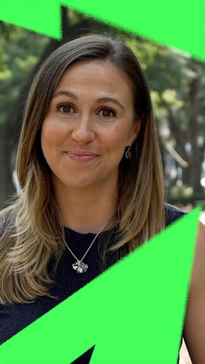 Sarah Dawkins, BBC Sport reporter, smiling at camera on the streets of Mexico City.