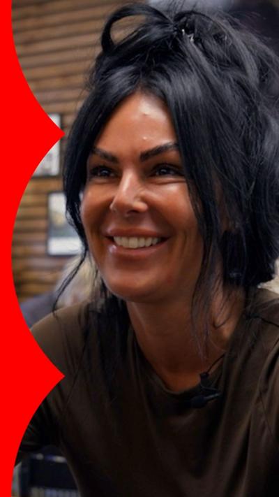 Smiling woman sat in a cafe