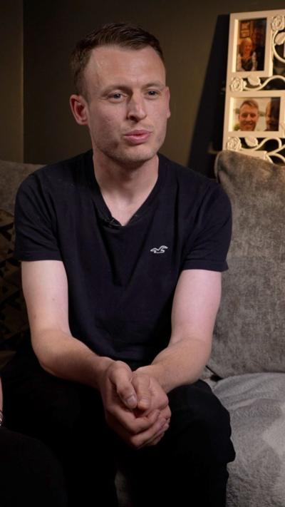 A man in a black t-shirt