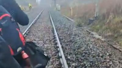 A man walking on train track