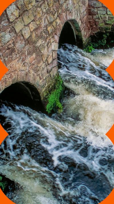 Wastewater from large sewage treatment plant flowing directly into a river.