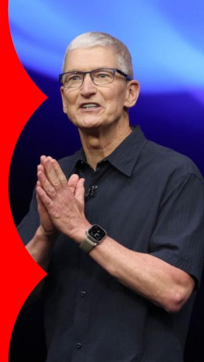 Tim Cook wears a black shirt with hands together