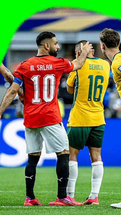 Mo Salah holding the back of the head of an Australian player after their 2026 World Cup match