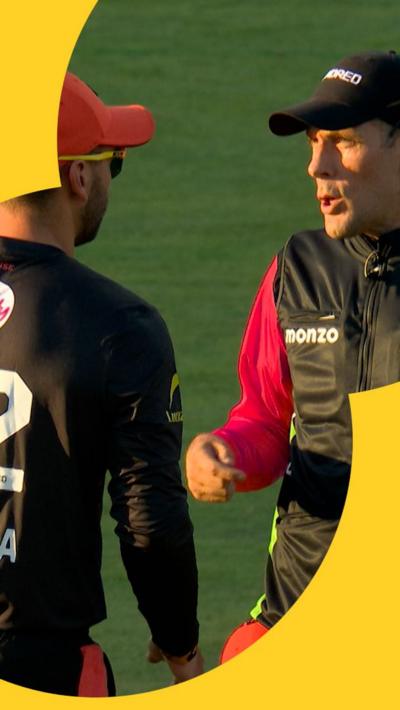The umpire making Donovan Ferreira aware that he has to bring a fielder in