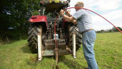 digging trenches to lay cables