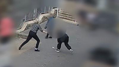 A still image of the moment a student attacked a teacher with a knife