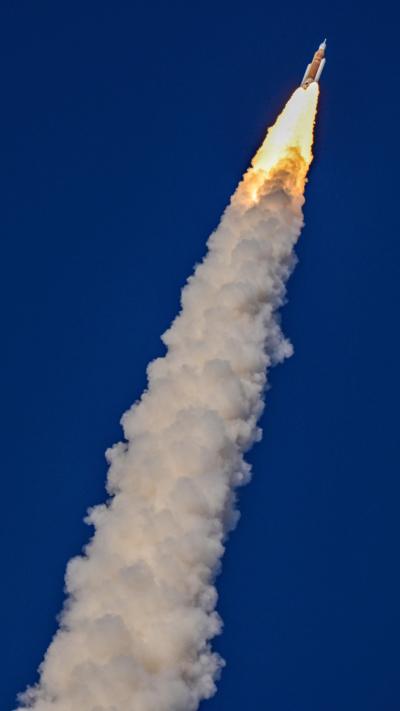 NASA's Artemis II mission to fly by the moon, comprising of the Space Launch System (SLS) rocket with the Orion crew capsule, lifts off from the Kennedy Space Center in Cape Canaveral, Florida
