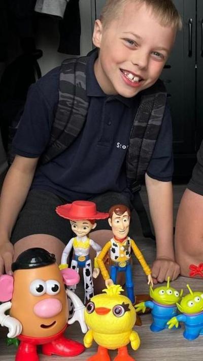 10-year-old Vinny with his Toy Story figures