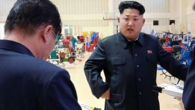 North Korean leader Kim Jong-Un visiting a farm machine exhibition