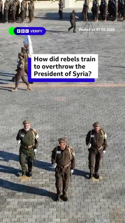 A promo image showing troops parading at the rebel training camp in Syria