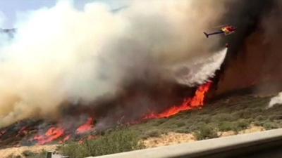 Helicopter douses flames