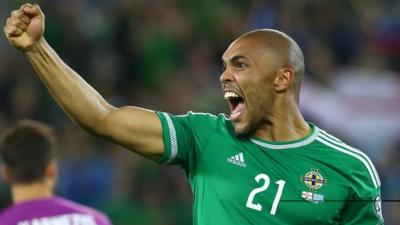 Former goalkeeper Josh Magennis showed his goal-scoring instincts as Northern Ireland booked their place at Euro 2016