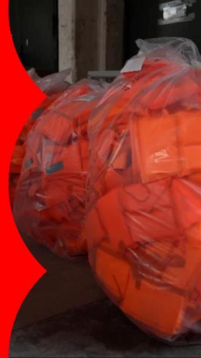Thousands of life jackets, covered in plastic wrapping