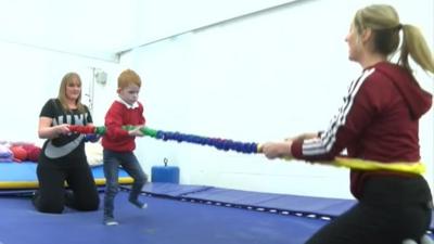 Daniel Brough walking at his physiotherapy session