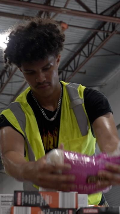 A volunteer sorts through some donations