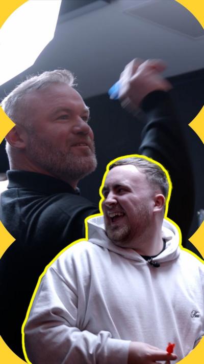 Luke Littler and Wayne Rooney smile as they play darts