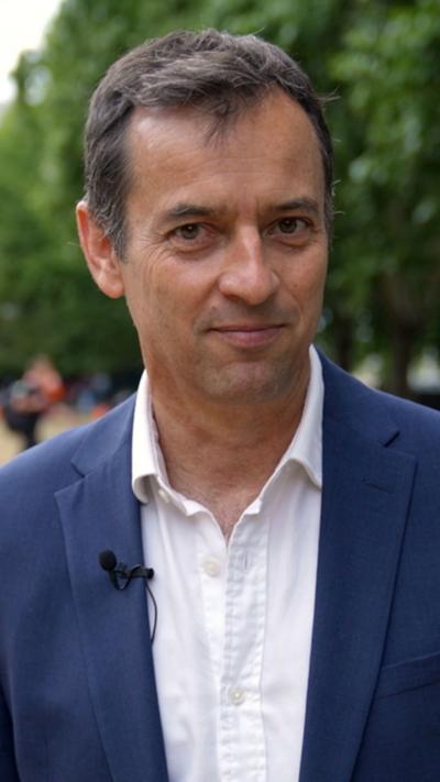 Damian Grammaticas looks into the camera as he stands outside parliament