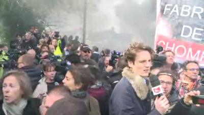 Workers boo as Emmanuel Macron arrives at the Whirlpool factory in Amiens, 26 April