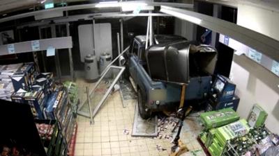 Car smashed into shop