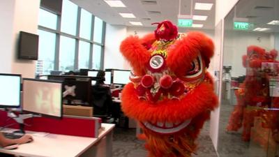 A Chinese lion on its way towards the BBC's new Singapore studio