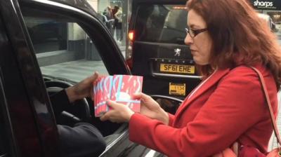 Books handed to taxi drivers