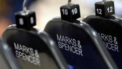 Marks and Spencer clothes on a rack