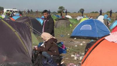 Refugees in a camp in Roszke on the Hungarian - Serbian border.