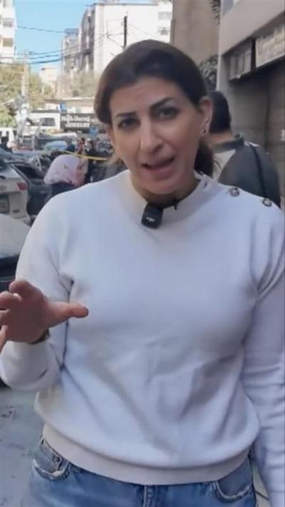 Carine looking into the camera and speaking