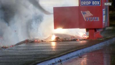 Ballots burning inside a ballot drop box in Vancouver, Washington