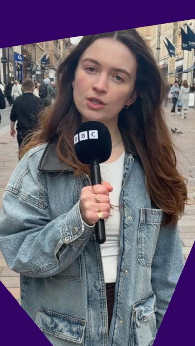 BBC's Rebecca Tierney
speaks to the camera holding a mic.