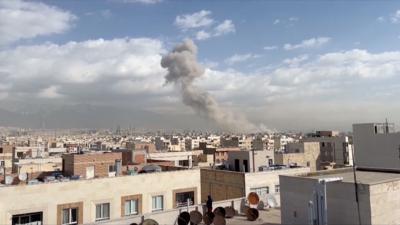 Smoke billows into air over Tehran skyline
