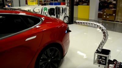 Tesla robotic charger