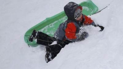 Child playing in snow