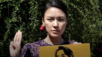 A Burmese protester displaying three-fingered salute