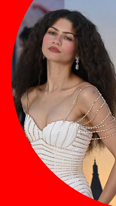 Zendaya wearing white dress with silver beads