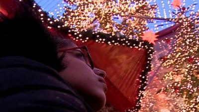 Noujain Mustaffa In front of Christmas lights in Germany