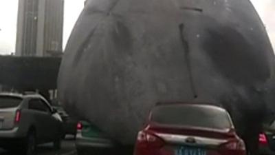 Inflatable moon on road