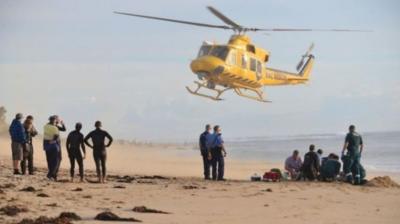 Man being treated on the beach