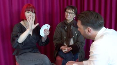 Laura London with Barry Caffrey holding cards