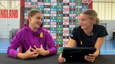 England women's football team members Jess Park and Chloe Kelly smile as they answer questions