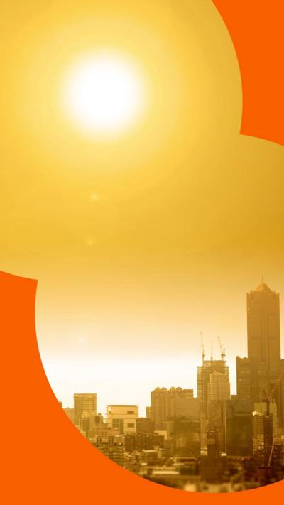 A panoramic view of a city with the sun directly overhead, casting an orange glow across the sky from the intense heat