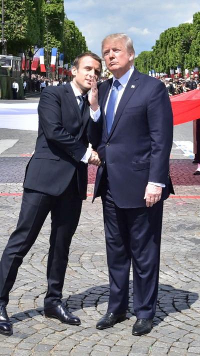 Emmanuel Macron and Donald Trump shake hands in Paris